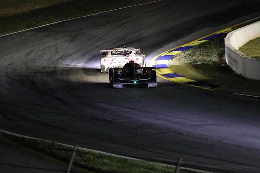 two cars racing into the night